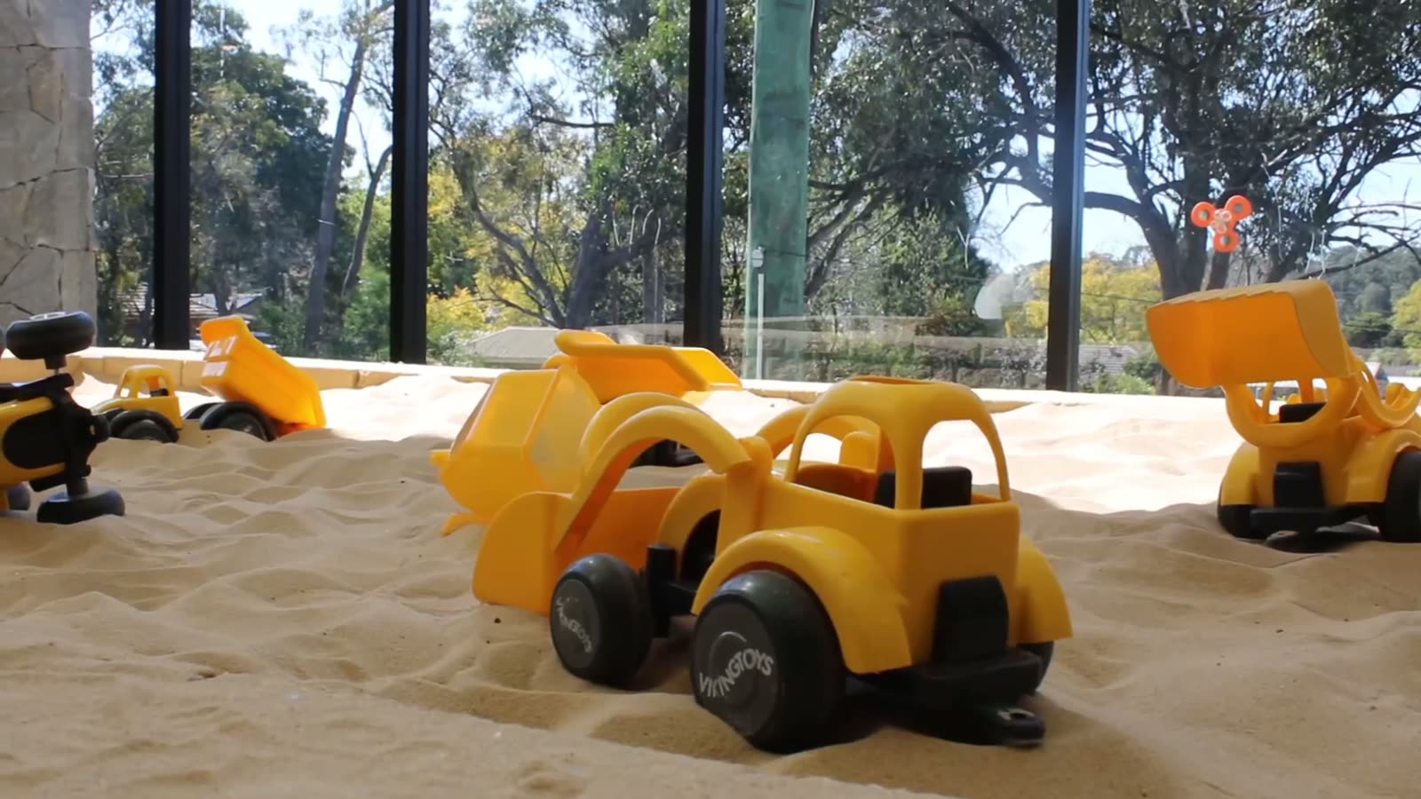 Toy diggers in the sandpit